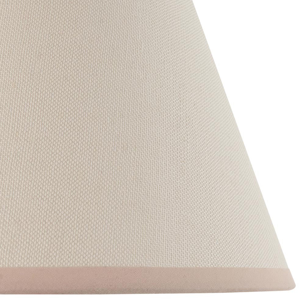 Close-up of the Brockbury 25cm tapered lamp shade in vintage white fabric with an almond taped edge, shown against a plain white background.