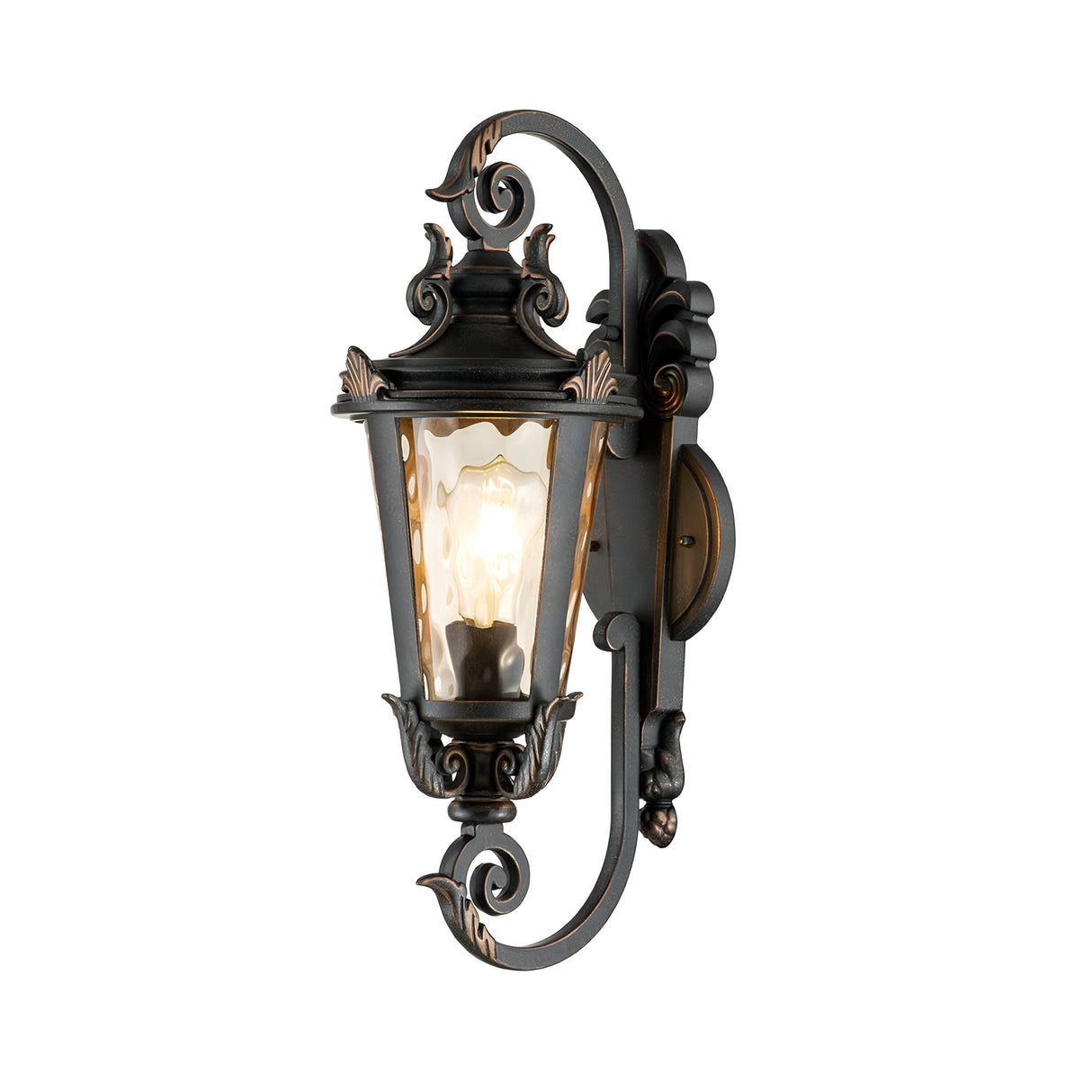 The Baltimore 1 Light Outdoor Medium Wall Lantern in weathered bronze showcases a vintage-style design with detailed scrollwork. Its clear glass panels allow the glowing bulb to embody a classic vintage-inspired aesthetic.