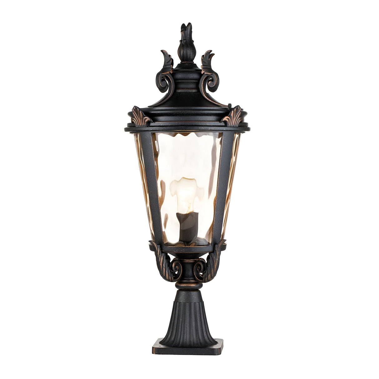 The Baltimore 1 Light Large Pedestal Lantern in a weathered bronze finish boasts a glass enclosure, decorative top, and glowing light bulb. This traditional outdoor lantern is elegantly mounted on a sturdy base and adorned with bronze accents.