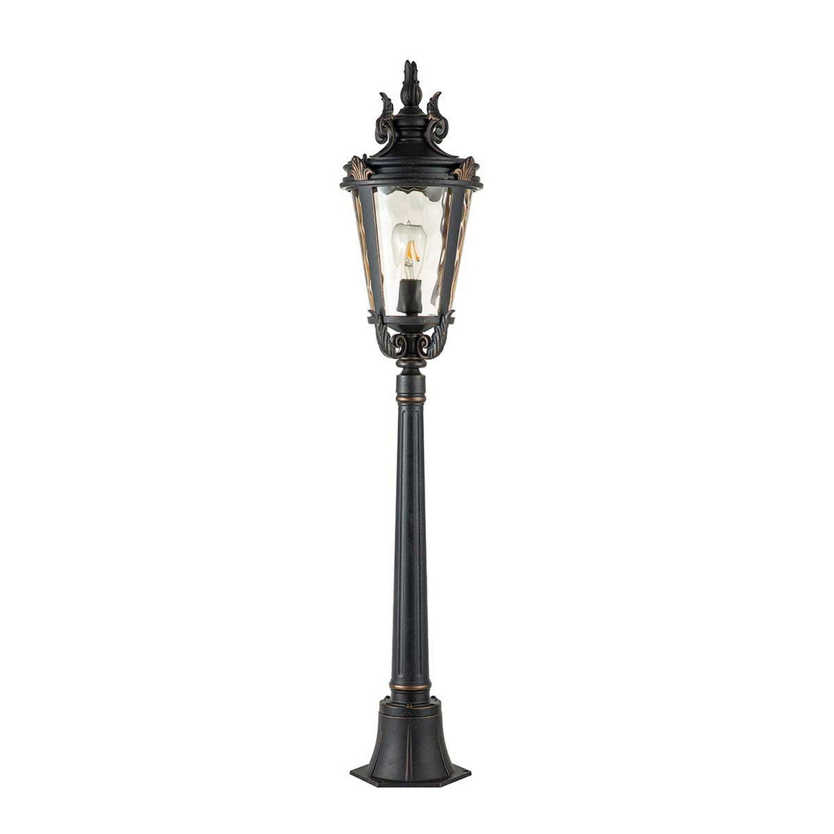 The Baltimore 1 Light Medium Pillar in weathered bronze is a vintage-style outdoor lamp post featuring an ornate design and a glass enclosure that houses a single light bulb on a tall pole, perfect for infusing timeless charm into your outdoor lighting.
