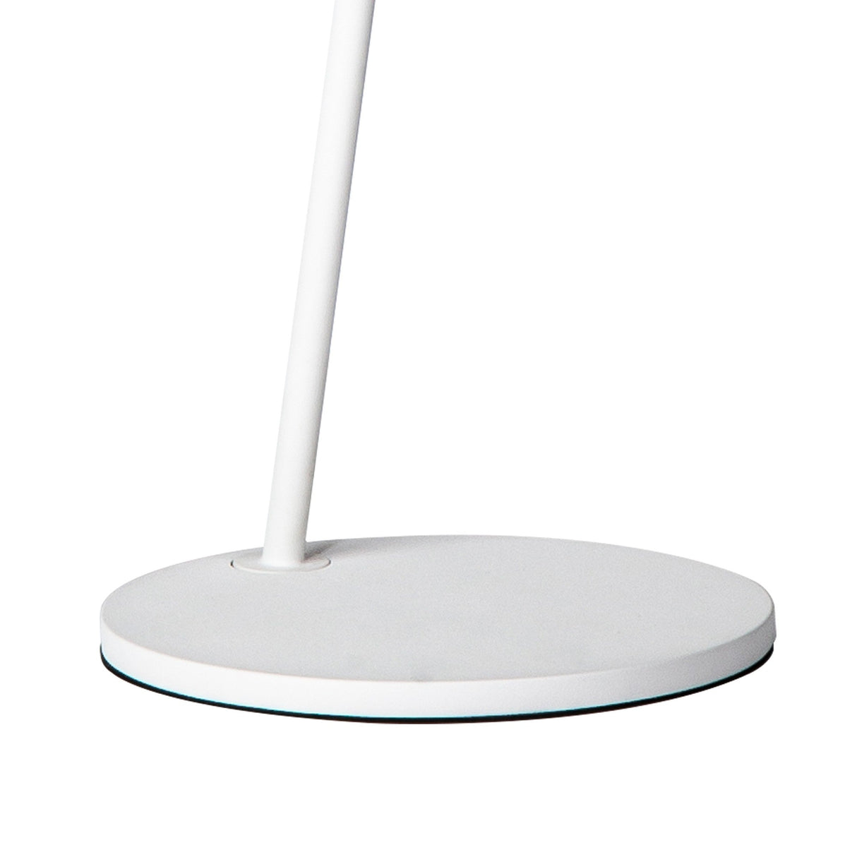 A close-up of the Capuccina LED Floor Lamp 8.5W 3000K in White shows its round base and slender pole, highlighting the lamp’s modern design against a plain white background.