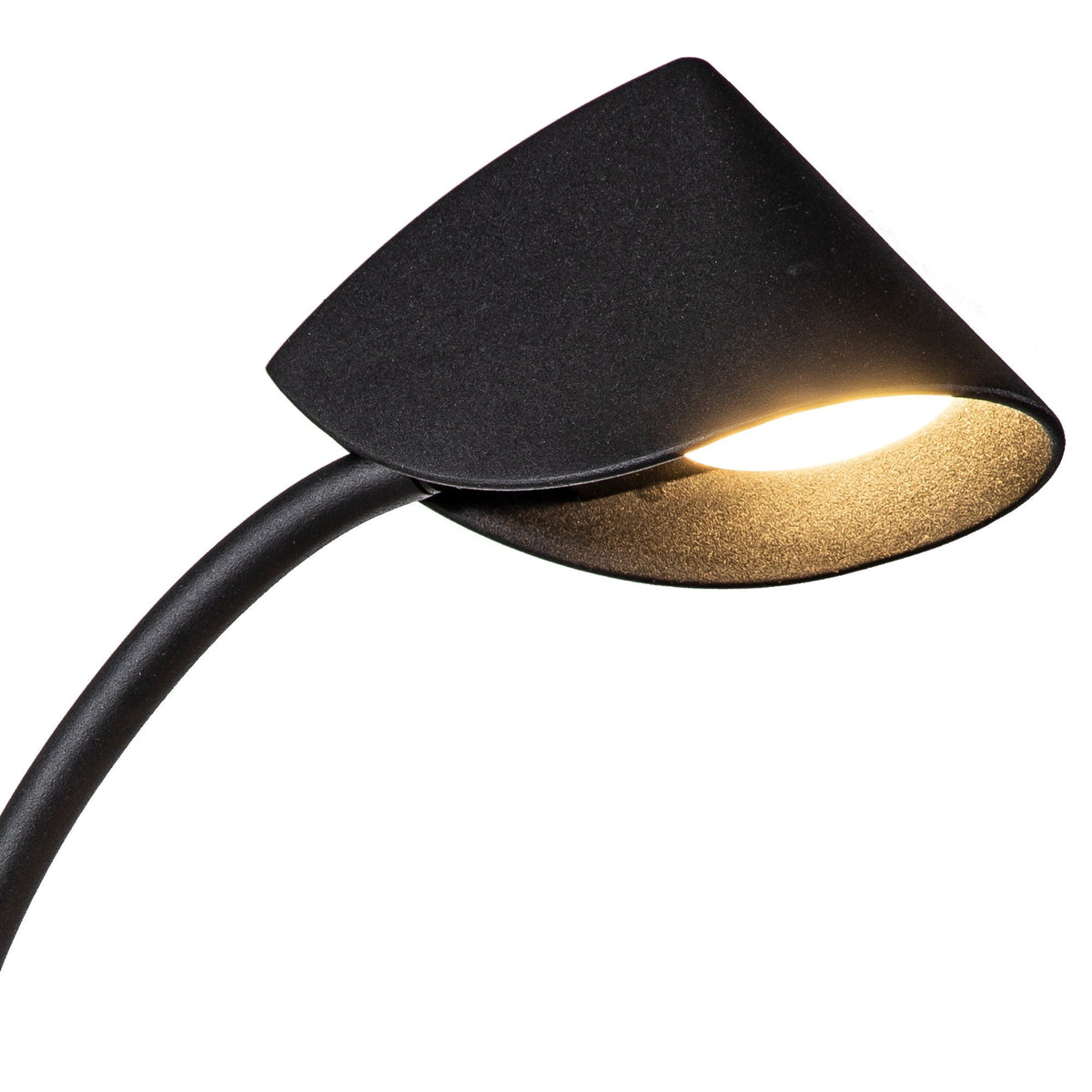 Close-up of the Capuccina Small LED table lamp's folded cone shade in matt black, illuminated warm white on a curved stem against a white background.