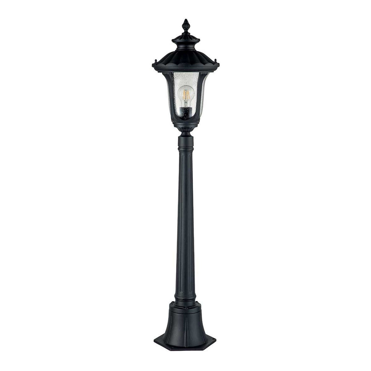 The Chicago Small Pillar Lantern in Black offers a vintage aesthetic with its classic lantern design, featuring a transparent glass case that reveals a visible bulb. Ideal for outdoor lighting, it's mounted on a tall, slender pole with an ornate base.