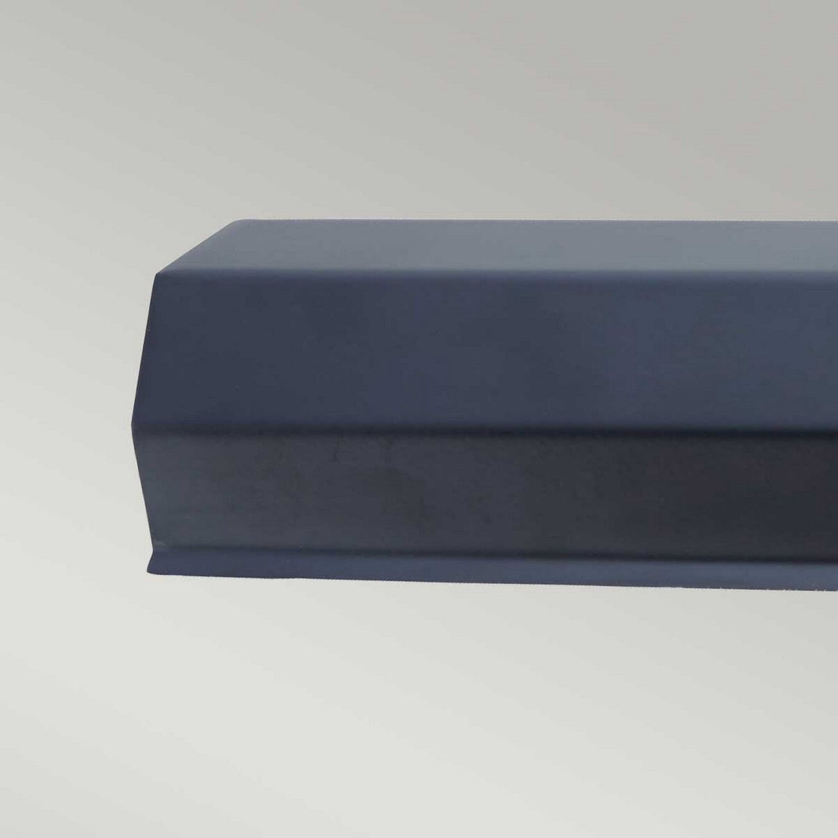 A close-up image of a Chawton Medium Picture Light in black, featuring sharp lines and reflecting modern design lighting, set against a plain light gray background.