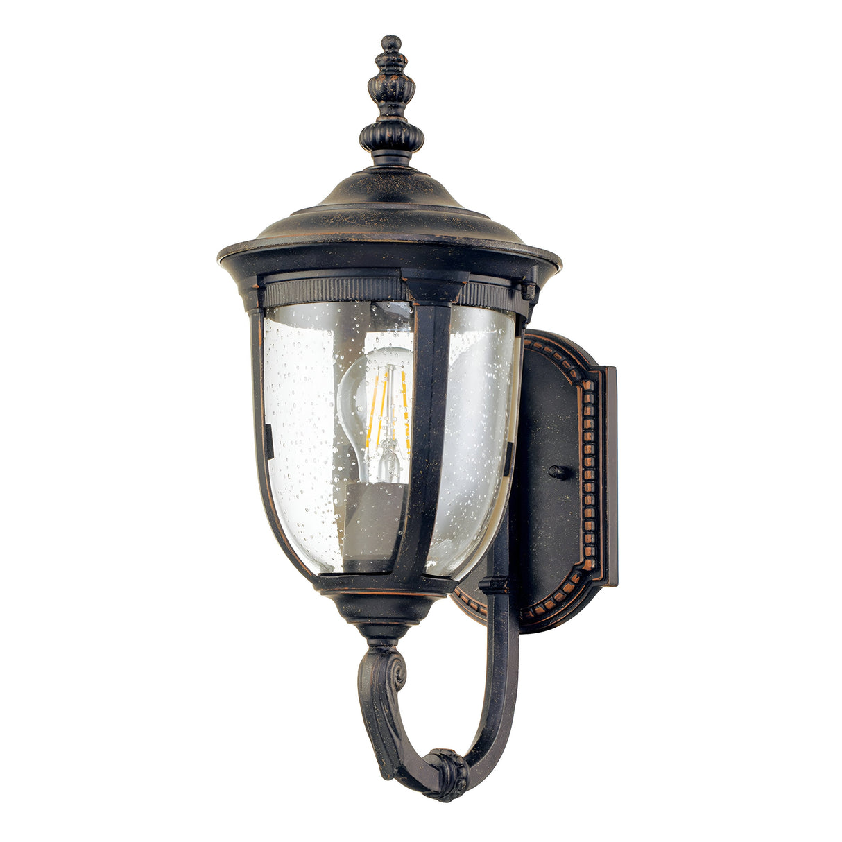 The Cleveland-1 Outdoor Small Wall Lantern in weathered bronze features a black, vintage-style design with clear seeded glass showcasing a filament bulb. It's mounted on an ornate bracket and is highlighted by a rounded top and decorative details that enhance its classic charm.