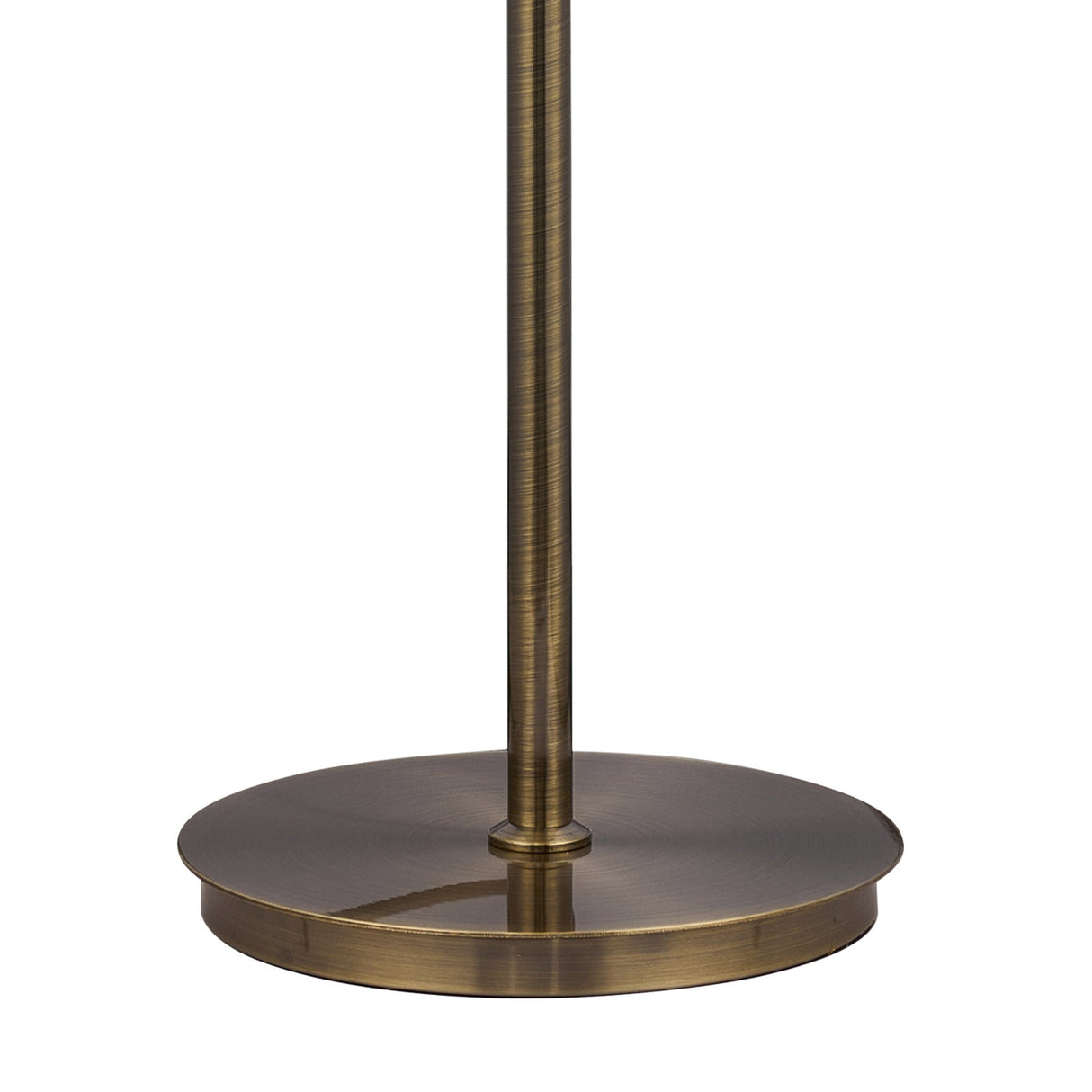 A close-up of the Coniston 3 Light Crystal Floor Lamp’s base and lower pole, showing its round, flat base with an antique brass finish and vintage-inspired design.