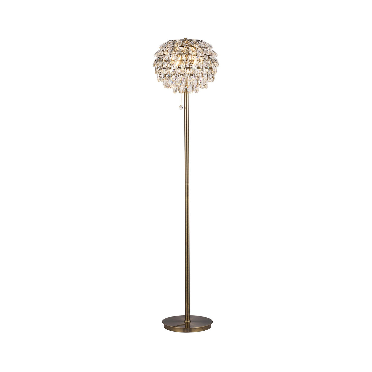 The Coniston 3 Light Crystal Floor Lamp in antique brass features a tall, vintage-inspired design with a round base and stem, topped by a dome cluster of hanging crystals for an elegant decorative touch.