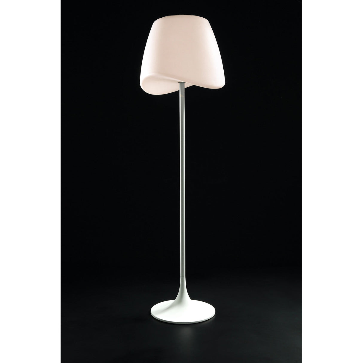 The Cool 2 Light Floor Lamp in matt white with an opal white, asymmetrical shade and slim, straight pole stands against a solid black background, offering stylish dimmable ambient lighting.
