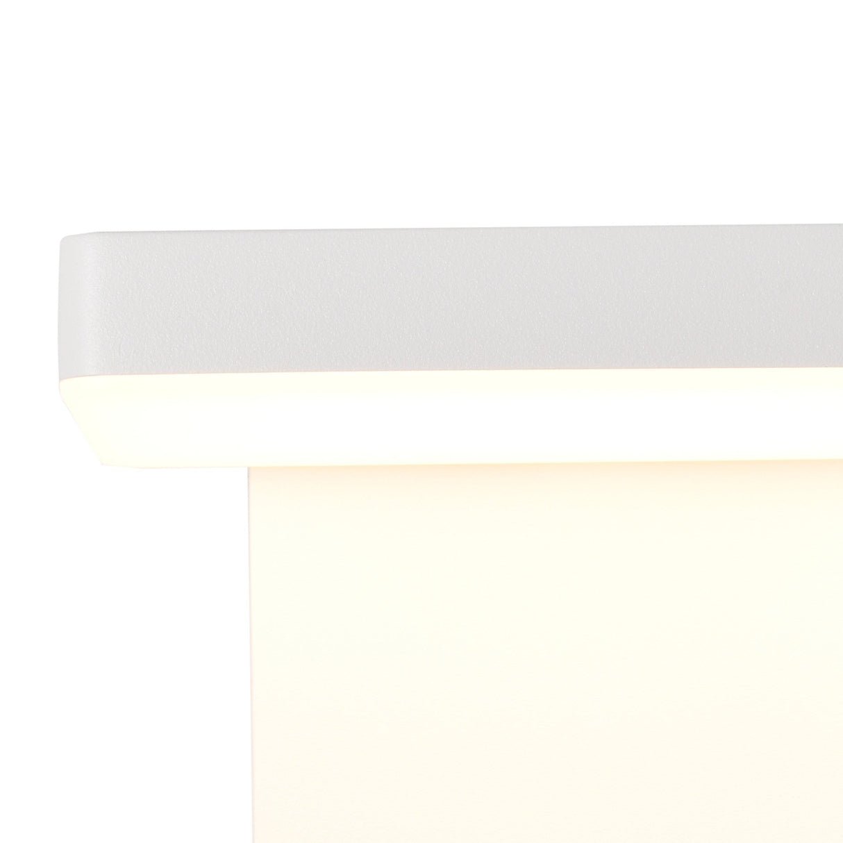 Mantra Cooper outdoor LED wall light close-up showing white powder-coated rectangular housing with warm 3000K illumination glowing along the lower edge.