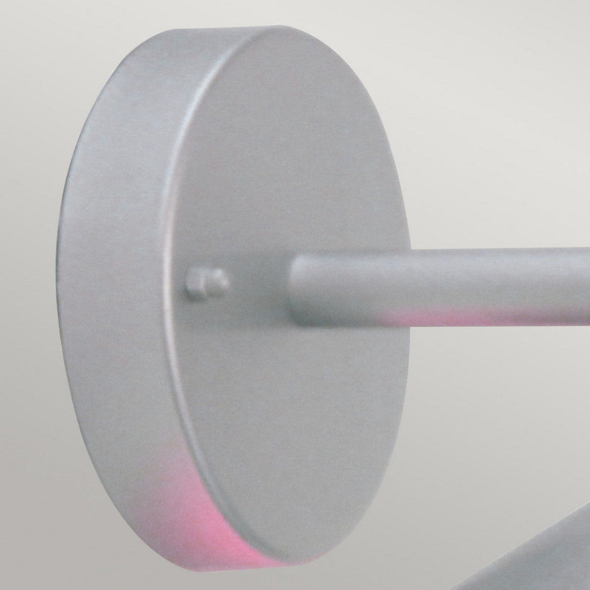 Close-up of the Copenhagen Outdoor Wall Lantern - Silver's round, stainless steel mounting bracket attached to a rod against a neutral background. The bracket and rod feature a matte silver finish with a hint of pink reflection, capturing the sleek elegance typical of Scandinavian design.