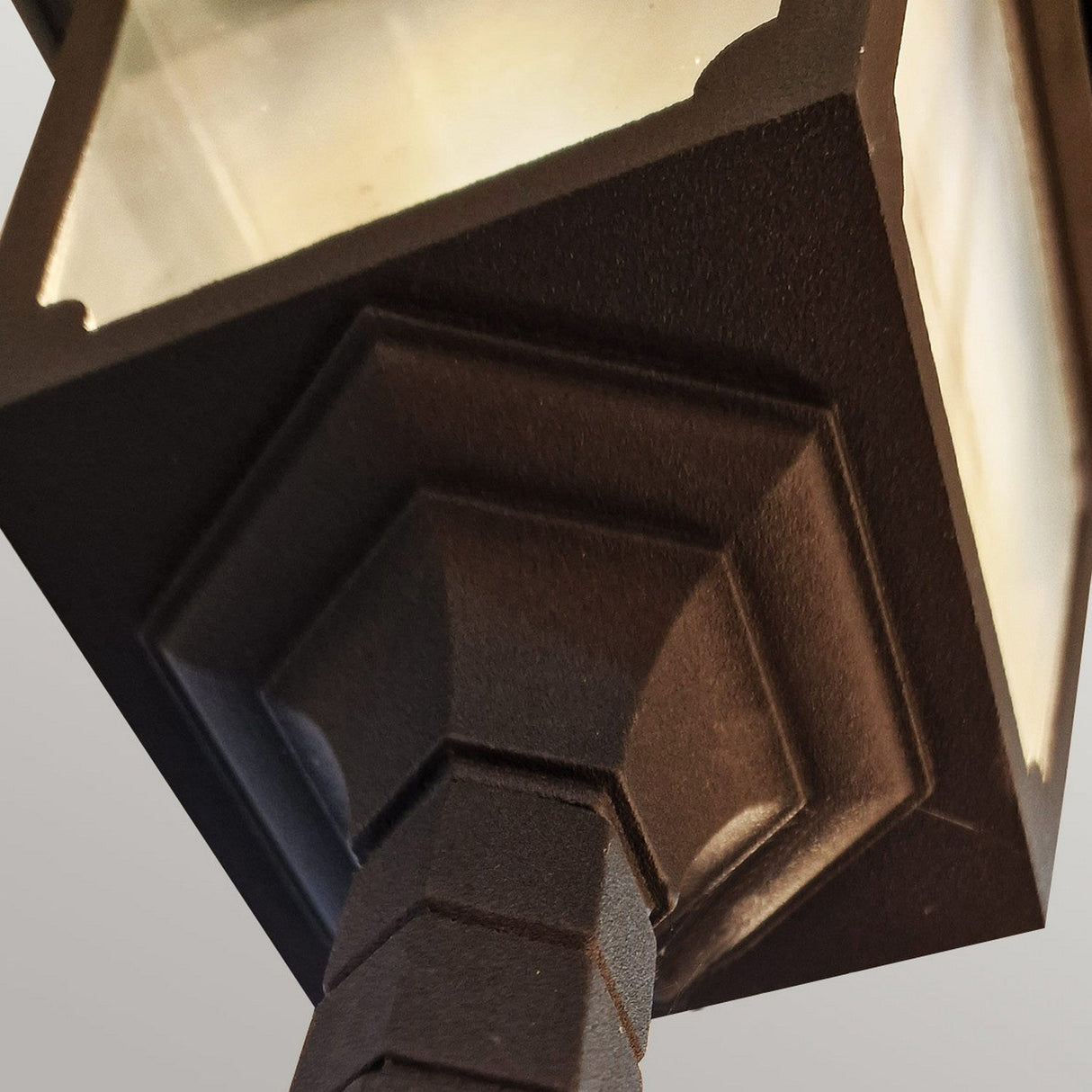 Close-up view of the Chapel 2 Light Twin Post - Black, a vintage-style street lamp with a classic black finish against a light gray background. It features a square lantern with frosted glass panels and decorative molding, crafted from die-cast aluminum. Perfect for enhancing your outdoor lighting ambiance.