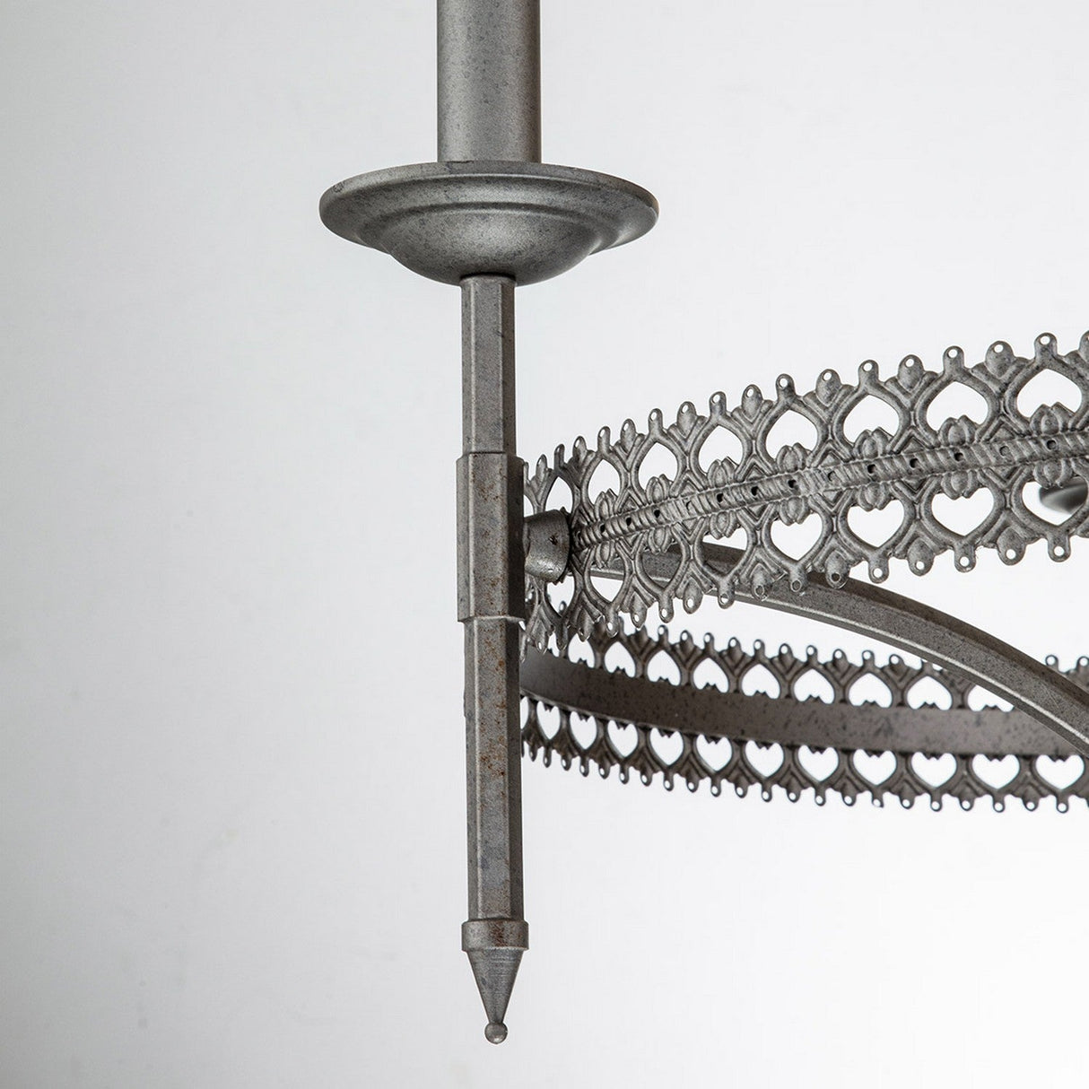 Close-up of the Crown 3 Light Chandelier in a graphite finish, showcasing decorative metalwork with heart-shaped lattice patterns. This design is ornate and vintage, highlighting fine craftsmanship, elegant detailing, and traditional influence.