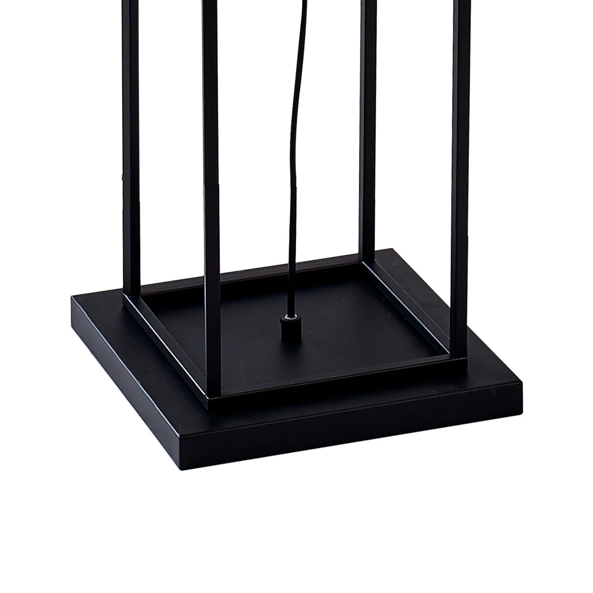 Close-up of the base of the Desigual Small 1 Light Floor Lamp in matt black, featuring a square platform, open rectangular frame, modern geometric design, and a central electrical cord.