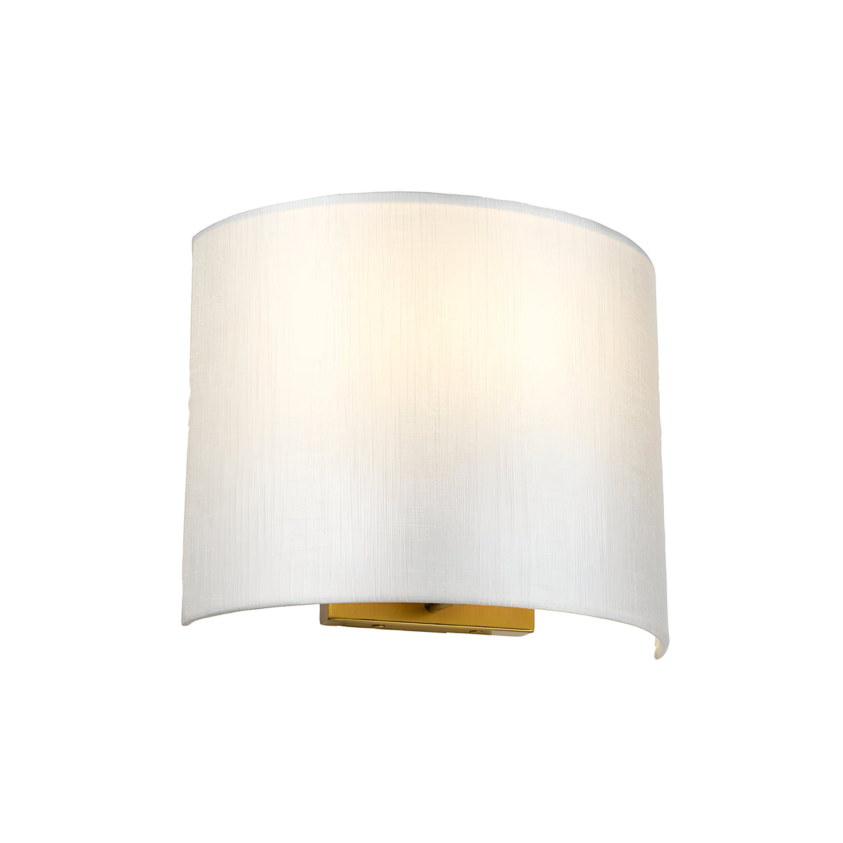 The Cooper Medium Curved Wall Light in aged brass showcases a medium curved design paired with a faux silk shade. It emits a soft glow, creating a warm and inviting ambiance against a plain white background.