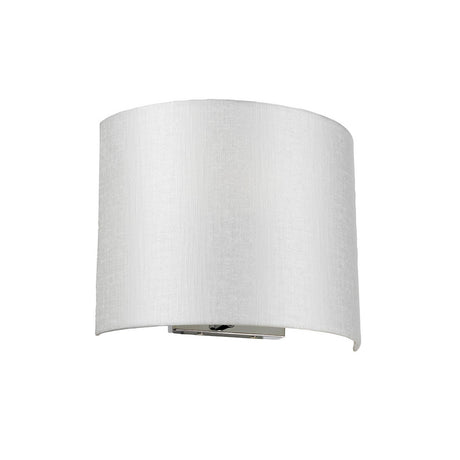 The Cooper Medium Curved Wall Light in polished chrome boasts a sleek design, featuring a white fabric shade. It's mounted on a rectangular metal base with elegant chrome accents, perfect for adding a minimalist touch to contemporary interiors.