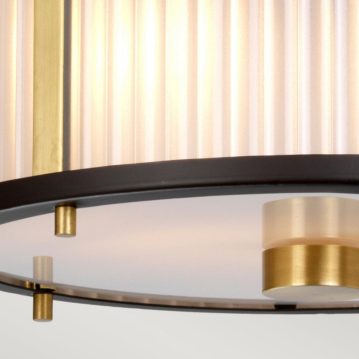 A detailed view of the Corona 2 Light Pendant / Semi-Flush in Bronze Dark Brown showcases its ribbed glass shade and brass accents. The design is minimalistic, emphasizing circular elements and a dark brown bronze frame that exudes a sleek and elegant look.