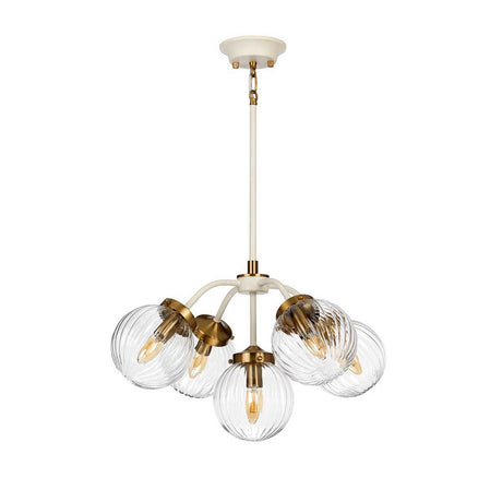 The Cosmos 5 Light Pendant - Cream Painted & Aged Brass is a modern chandelier showcasing five ribbed, hand-blown glass globe lampshades on gracefully curved metal arms. With a cream and aged brass finish, it elegantly suspends from a central rod, seamlessly merging contemporary style with retro-inspired design.