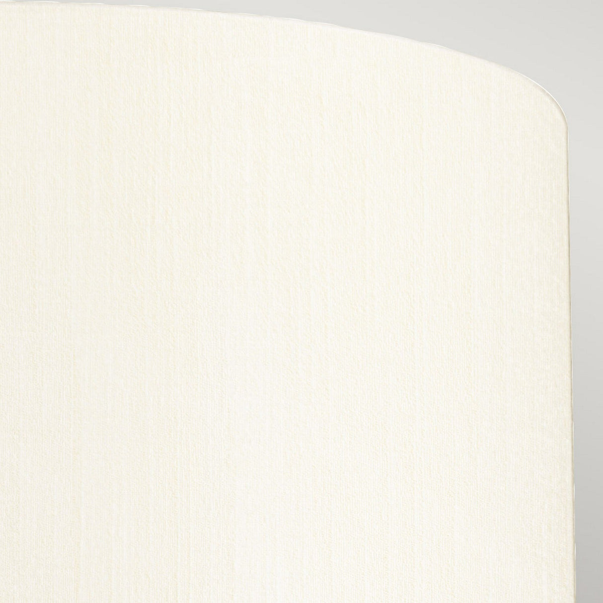 The textured, beige fabric with a subtle vertical weave pattern elegantly adorns the curved corner of an object, resembling the Fletcher 14" Flush's ivory shade against a soft gray background, exuding an understated beauty similar to faux silk.