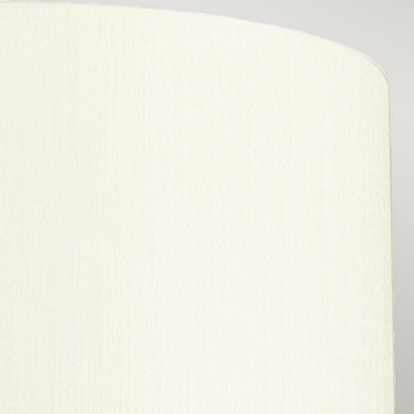 The textured, beige fabric with a subtle vertical weave pattern elegantly adorns the curved corner of an object, resembling the Fletcher 14" Flush's ivory shade against a soft gray background, exuding an understated beauty similar to faux silk.