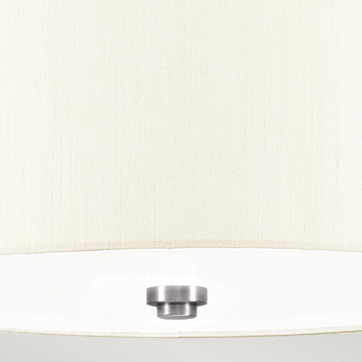 A close-up of the Fletcher 14" Flush - Polished Chrome With Ivory Shade reveals its cream-colored fabric lampshade paired with a polished chrome ceiling fixture at the center bottom. The combination of textured fabric and smooth metal provides a striking contrast, enhancing its modern lighting aesthetic against a light and neutral backdrop.