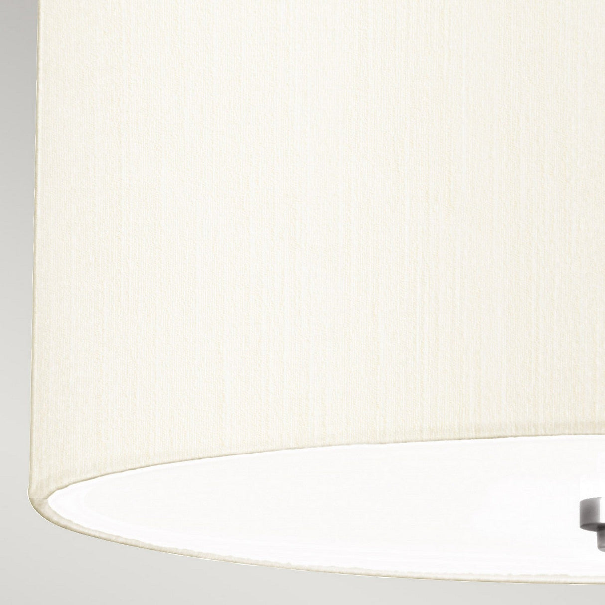 Close-up view of the ivory fabric lampshade with a subtle texture, complementing the Fletcher 14" modern lighting fixture. The image shows the bottom edge and interior of the shade, part of a polished chrome ceiling mount. The neutral color and simple design add elegance to any space.