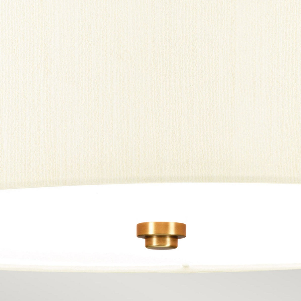 A close-up view from below showcases the Fletcher 18" Flush Ceiling Fixture, featuring an ivory shade and a central aged brass knob. The fabric's texture and the sleek metallic finish of the knob are beautifully highlighted.