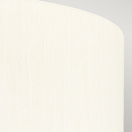 Close-up of a fabric with a cream-colored, textured surface reminiscent of the ivory shade seen in the Fletcher 26" Flush - Aged Brass. The fabric is draped, displaying an edge with a slight curve against a light gray background.