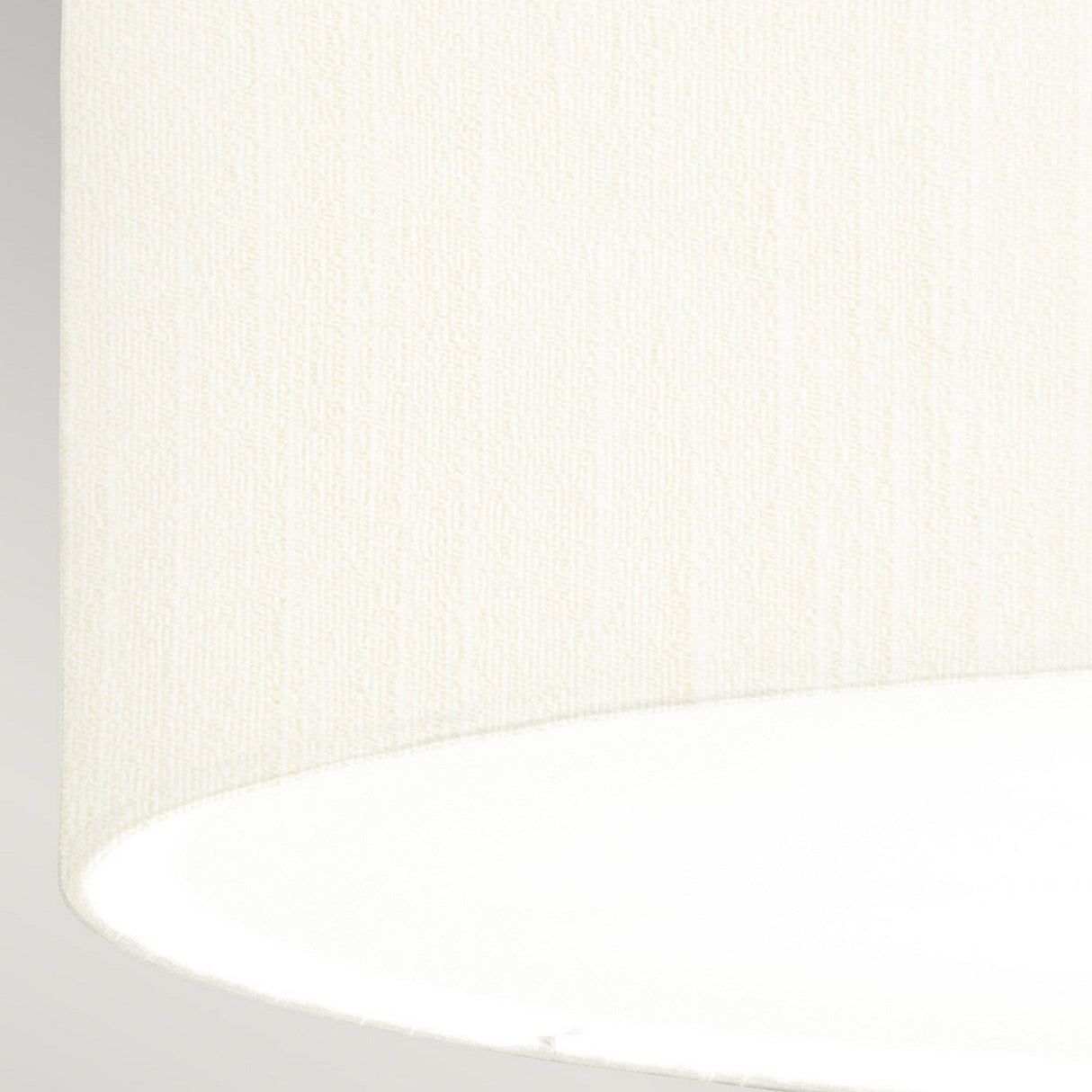 Close-up of the ivory lampshade from the Fletcher 26" Flush - Polished Chrome fixture set against a light gray background. The texture is clearly visible, with the bottom edge gently curving in the image, adding an elegant touch to any polished chrome ceiling fixture.