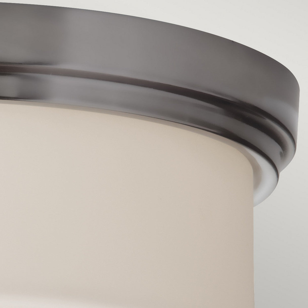 A close-up of the Kincaid 2 Light Flush in polished chrome, featuring an opal-etched glass shade and set against a plain white background. This fixture showcases a simple, modern design with clean lines.