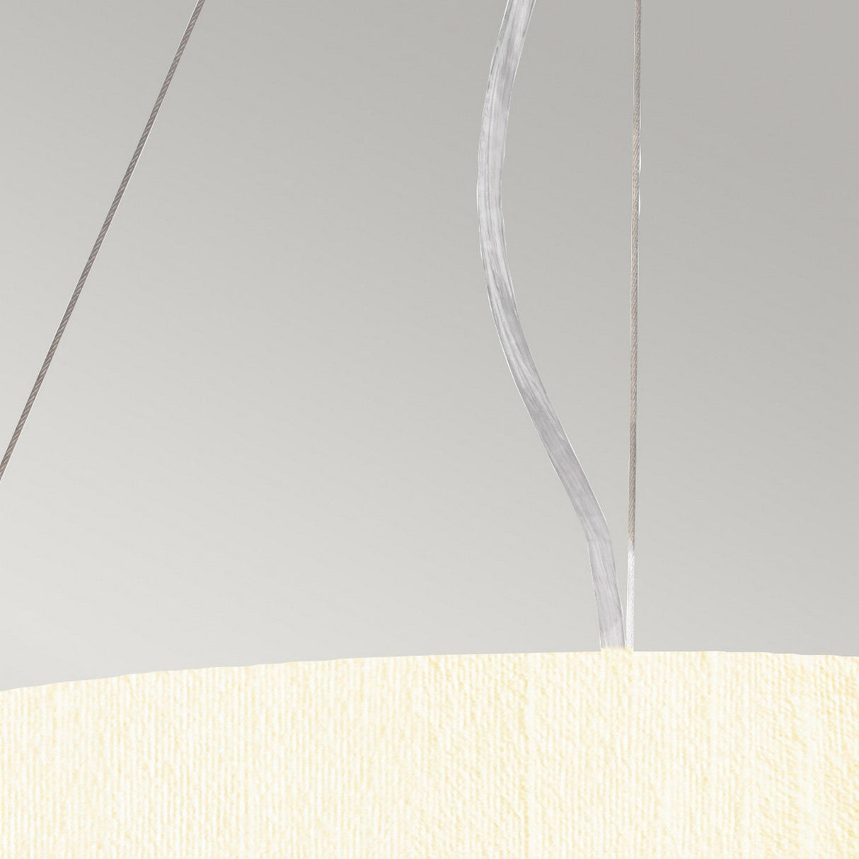 Close-up of the Pearce 18" Pendant Light - Aged Brass, Ivory Shade with a textured faux silk finish. Two distinct cords extend from the top against a neutral gray background, showcasing a minimalist and contemporary design accented with elegant Aged Brass details.