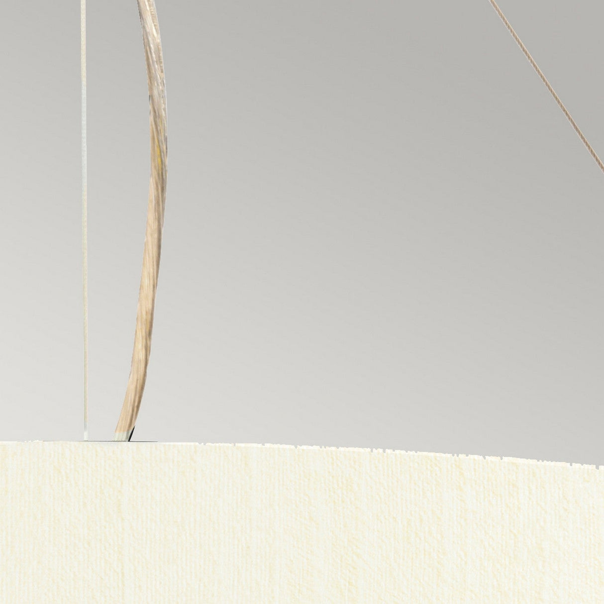 Close-up of the Pearce 22" Pendant Light in polished chrome, featuring an ivory textured shade, suspended by thin wires against a light gray background—ideal for enhancing sophisticated modern interiors.