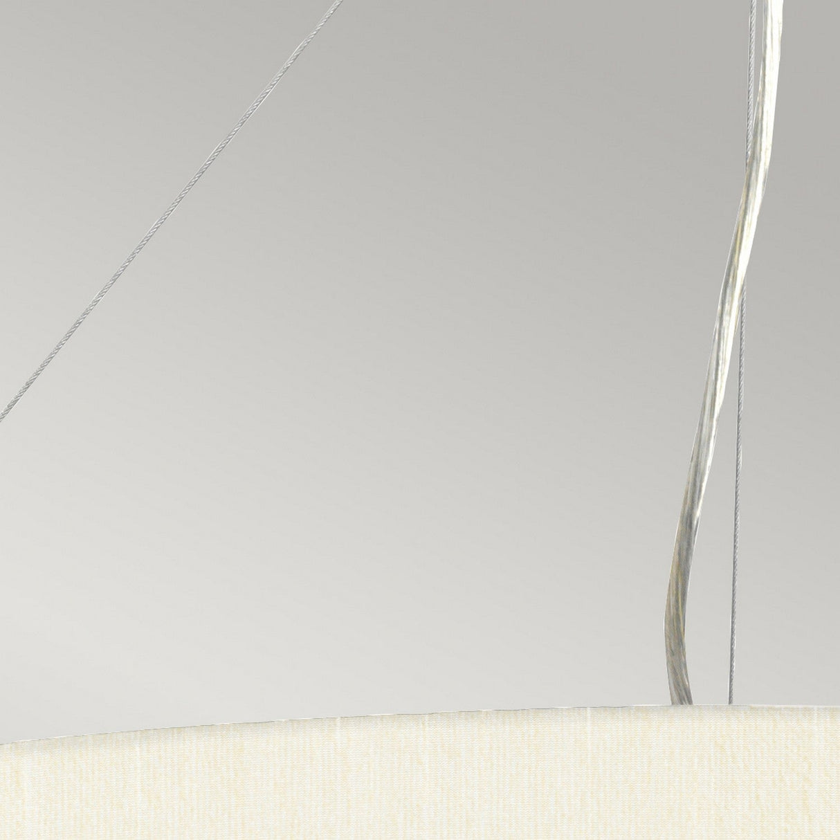 Close-up of the Pearce 26" Pendant Light in aged brass featuring thin metallic wires against a light gray background. A portion of the ivory faux silk shade is visible at the bottom, enhancing its elegant design.