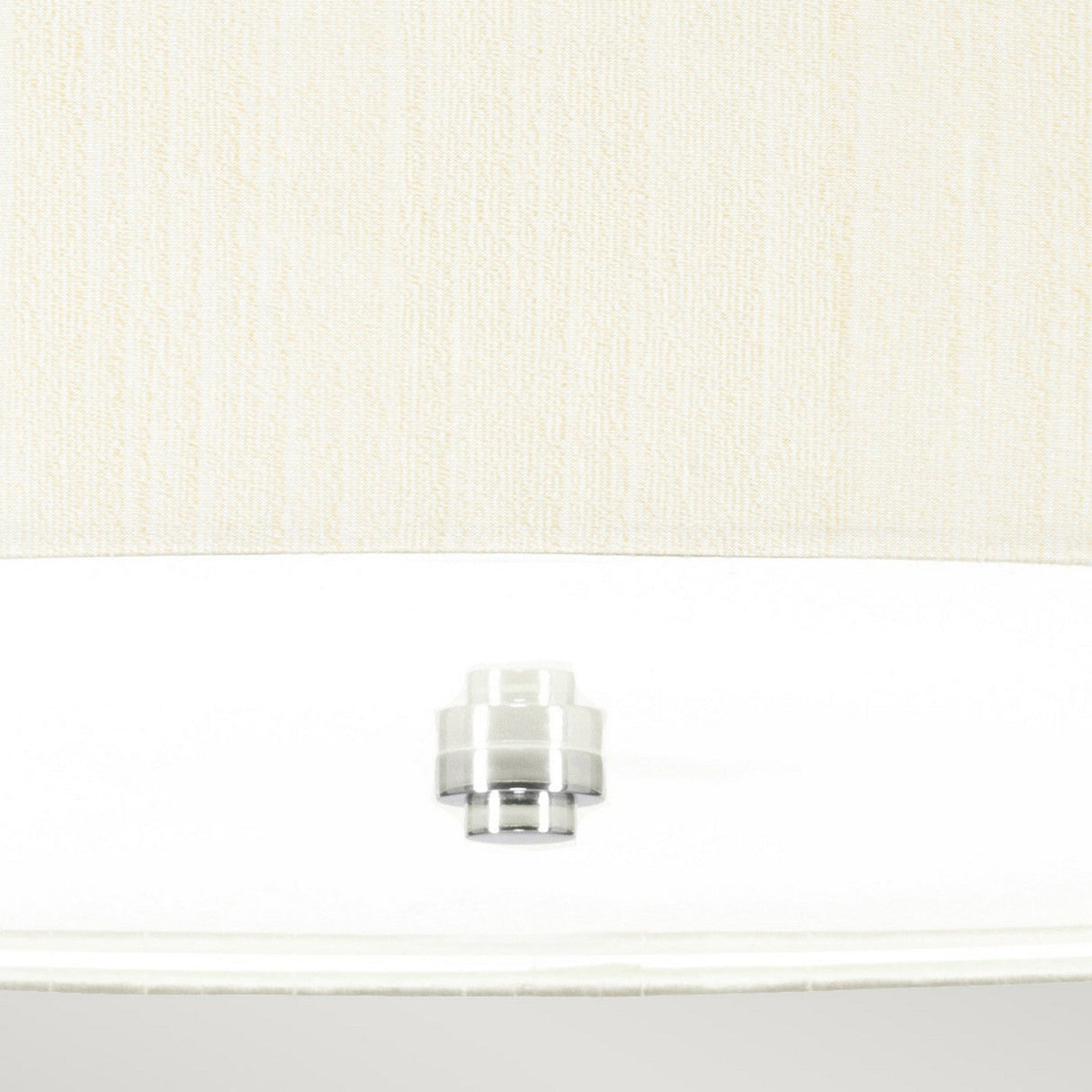 Close-up view of the Pearce 26" Pendant Light in polished chrome, centered on a round white surface and set against a textured beige background. This pendant light is perfect for modern interiors with its refined design and ivory shade.