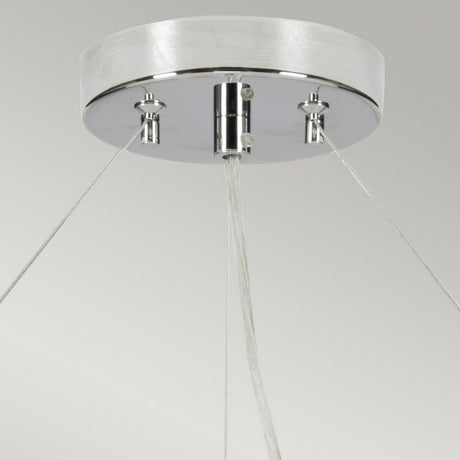 Close-up of the Pearce 30" Pendant Light - Polished Chrome, Ivory Shade, showcasing a modern lighting design with a round metallic base in polished chrome. Sleek cables elegantly extend from the base, supporting the structure against a neutral background.