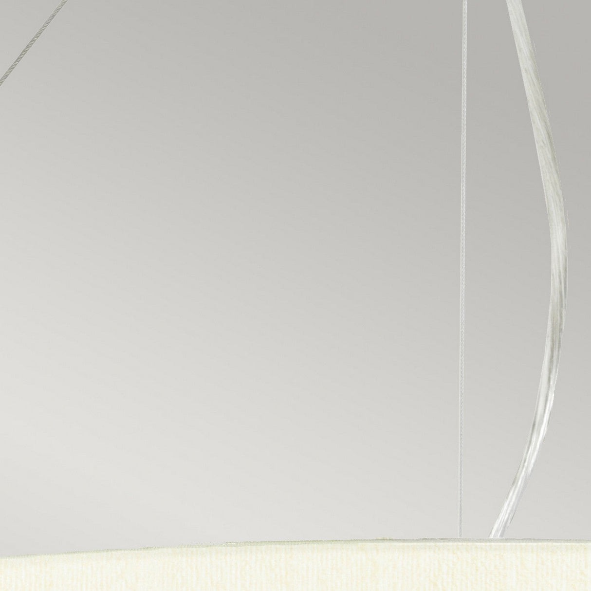 The Pearce 30" Pendant Light boasts a minimalist aesthetic with its simple round ivory shade, elegantly suspended by two thin cords. The polished chrome accents enhance its modern lighting design against a light gray backdrop.