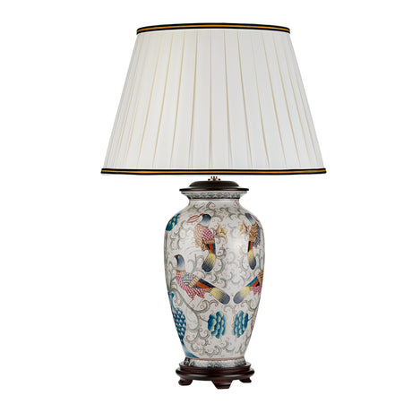 The Ping Table Lamp - Cream With Coloured Birds features a ceramic base adorned with hand-painted birds and floral designs. Its ivory cotton box pleat shade complements the lamp's elegance, which is enhanced by its dark wooden base, making it a sophisticated addition to any room.