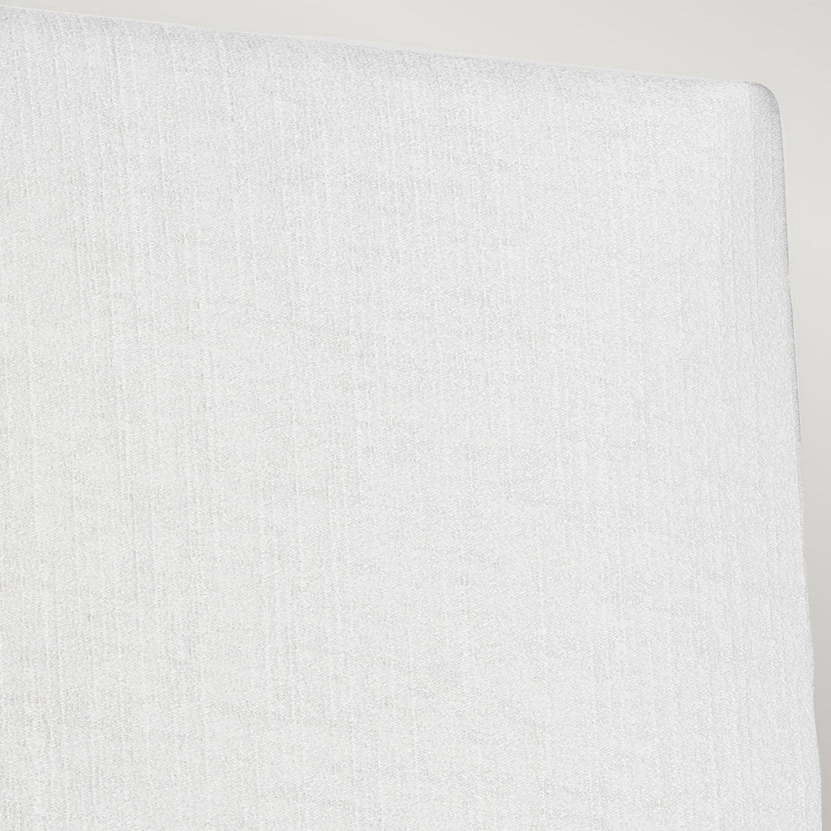 Close-up of the Riley Large Rectangular Wall Light in Aged Brass, highlighting its soft, smooth texture reminiscent of an ivory shade's elegance, with a subtle vertical pattern that is both sophisticated and refined.