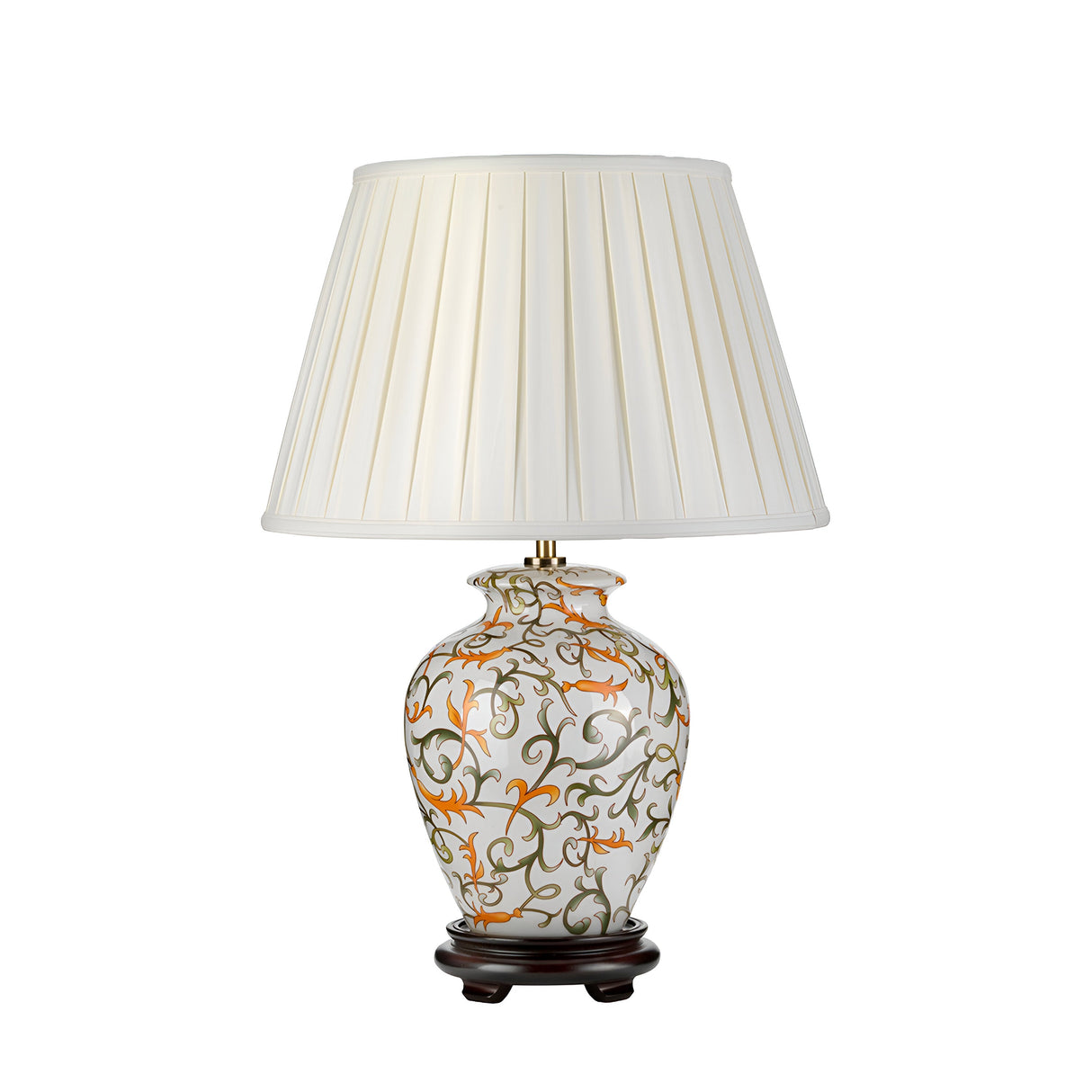 The Soling Table Lamp - Cream With Orange & Green showcases a decorative table lamp with a white pleated shade, flaunting a floral-patterned ceramic base inspired by oriental artistry, featuring vibrant orange, green, and brown hues. This elegant design is beautifully complemented by its dark wooden stand.