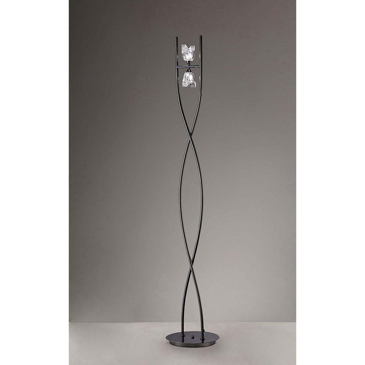 The Eclipse 2 Light Floor Lamp - Black Chrome features two crossed metal rods with a twisted design, two glass light fixtures near the top, and a round base—ideal for contemporary lighting in any modern space.