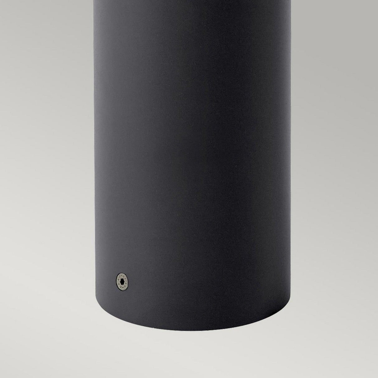 Close-up of a sleek, cylindrical black speaker against a light gray background, reminiscent of an Egersund LED Tall Bollard in Graphite. The bottom features a small, round metallic detail akin to energy-efficient LED designs.