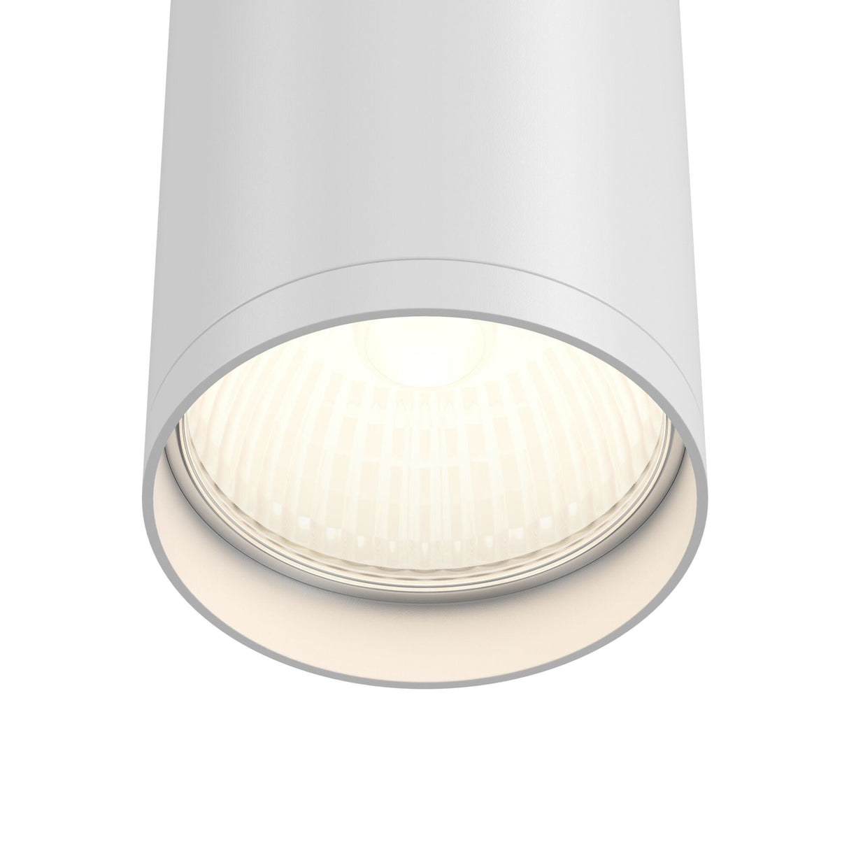 Close-up of the Focus S Fixed Round Surface Mounted Downlight in white, featuring a modern cylindrical design. The glowing bulb casts soft, energy-efficient light, ideal for contemporary interiors with its sleek and minimalist design.