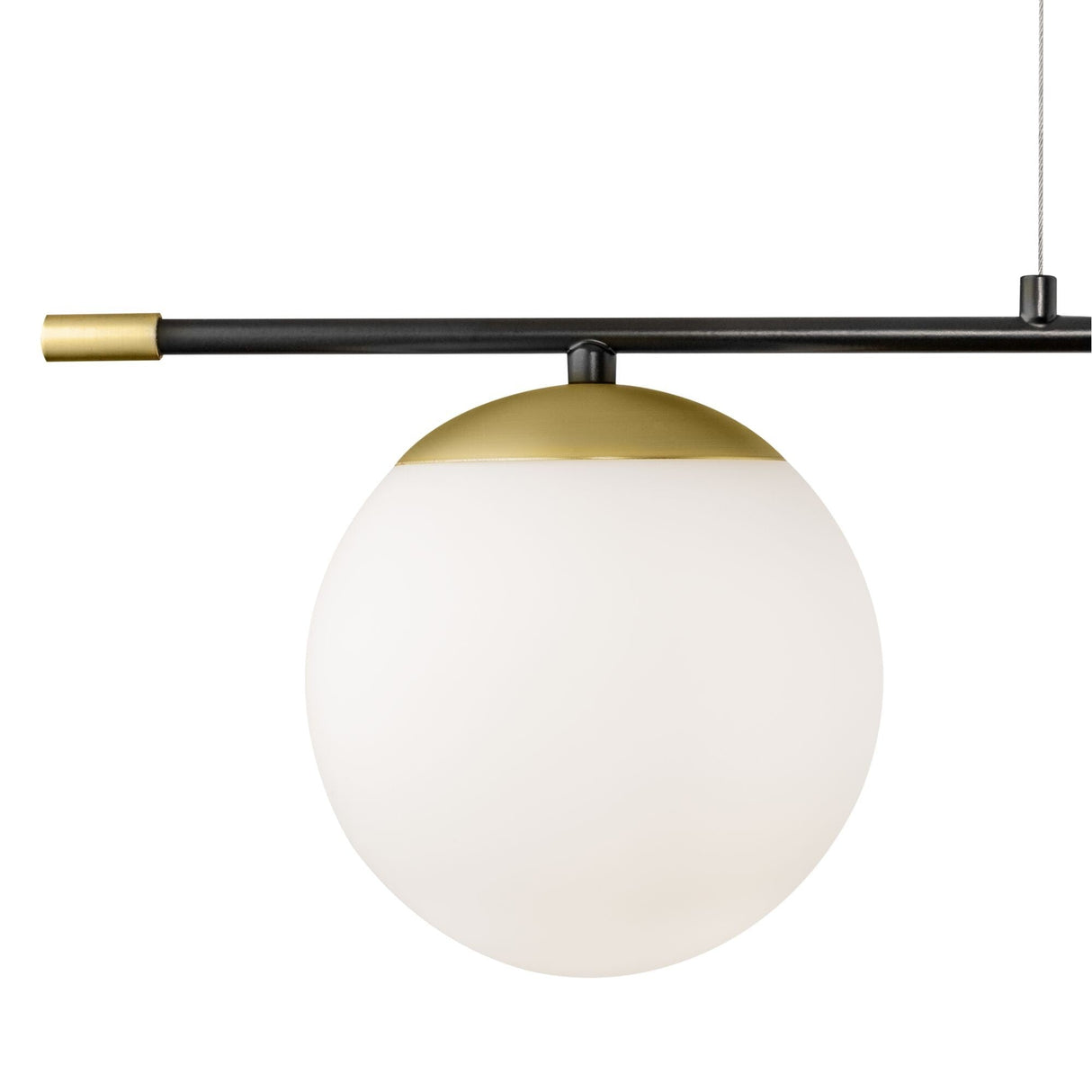 The Nostalgia 2 Light Suspension exudes modern elegance with its spherical white glass shade, gold top, and is suspended from a black rod with a gold accent, seamlessly blending retro charm into contemporary spaces.