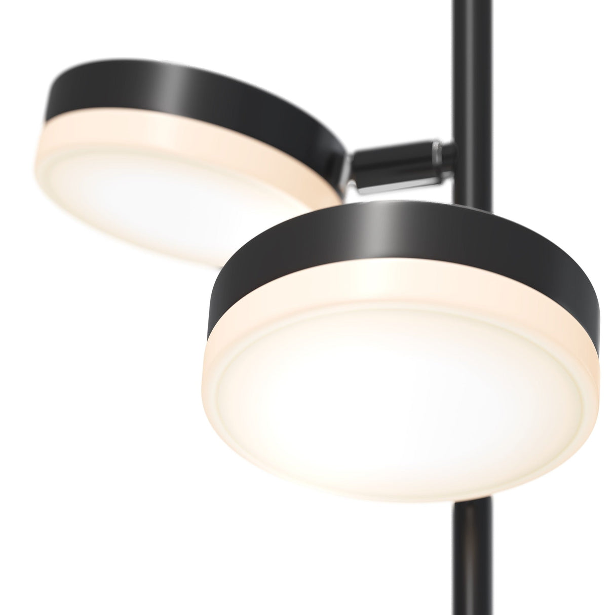 Close-up of two circular, modern lights on one black rod. With sleek fixtures featuring black rims, they emit a soft white glow, enhancing energy efficiency and modern style for a minimalist look. Product: Fad LED Floor Lamp - Black.