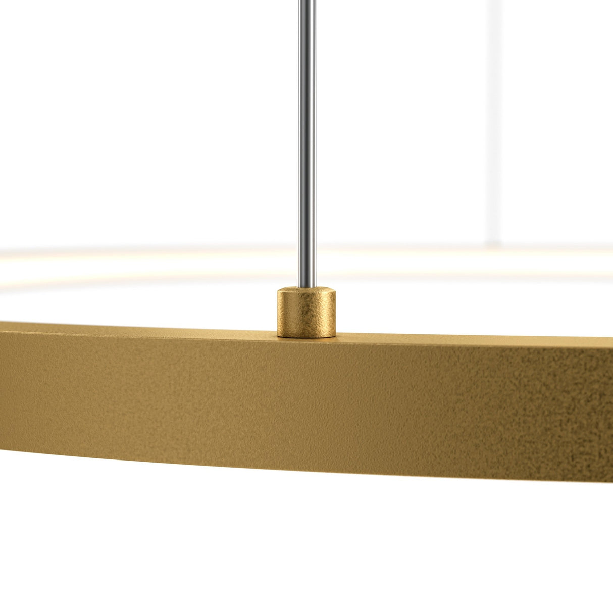 Close-up of the Glint LED Circular Suspension Light 80cm - Brass, highlighting its energy-efficient design with a gold circular frame and smooth texture. It hangs from a thin metal rod, focusing on the connection point where the rod meets the elegant brass-finished frame.
