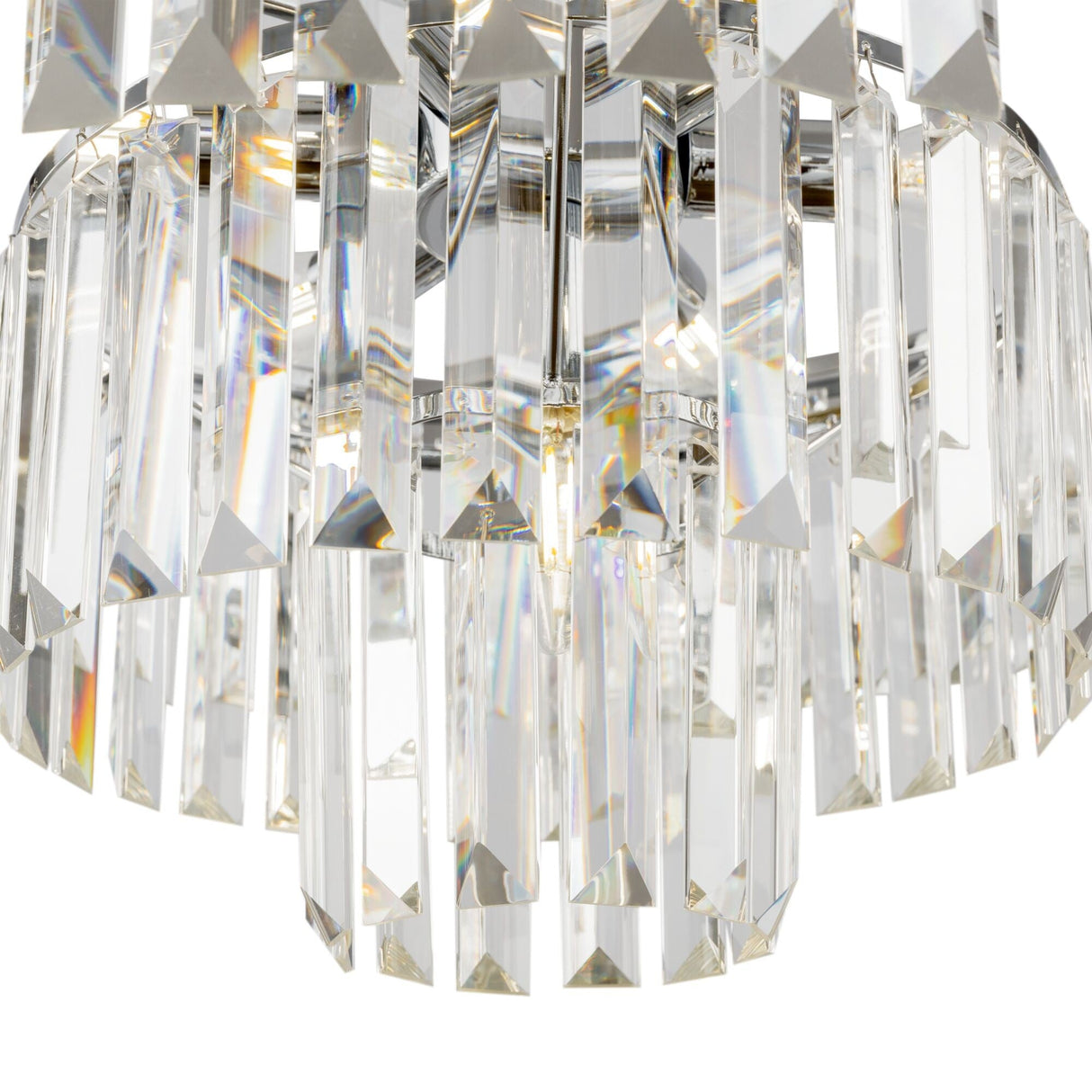 Element detail of Revero 7 light chandelier, focusing on the intricate chrome detailing.