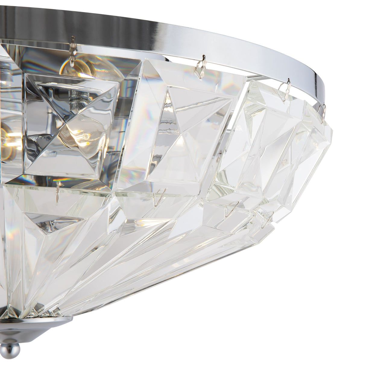 The Facet 6 Light Flush - Chrome & Crystal features a geometric pattern with chrome and crystal elements and faceted glass panels, reflecting light beautifully. This elegant fixture adds luxury, showcasing partially visible bulbs within its sophisticated design.