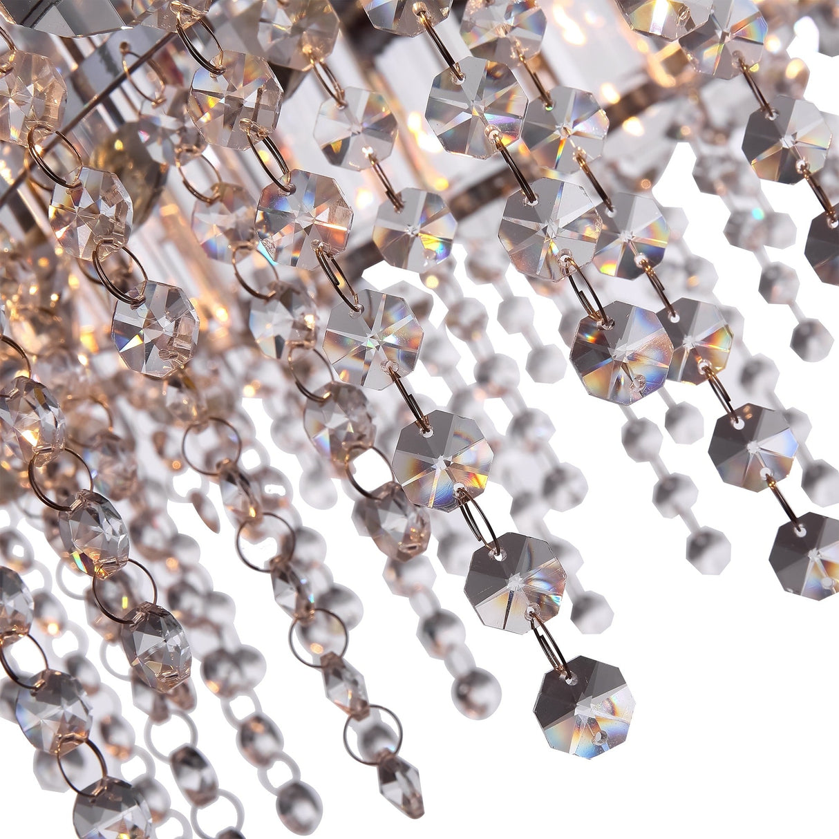 The Hail 8 Light Chandelier - Chrome is adorned with numerous faceted beads and prisms that hang in strands. Its crystal accents beautifully reflect and refract light for a sparkling effect, boasting intricate arrangements that exude elegance and luxury.