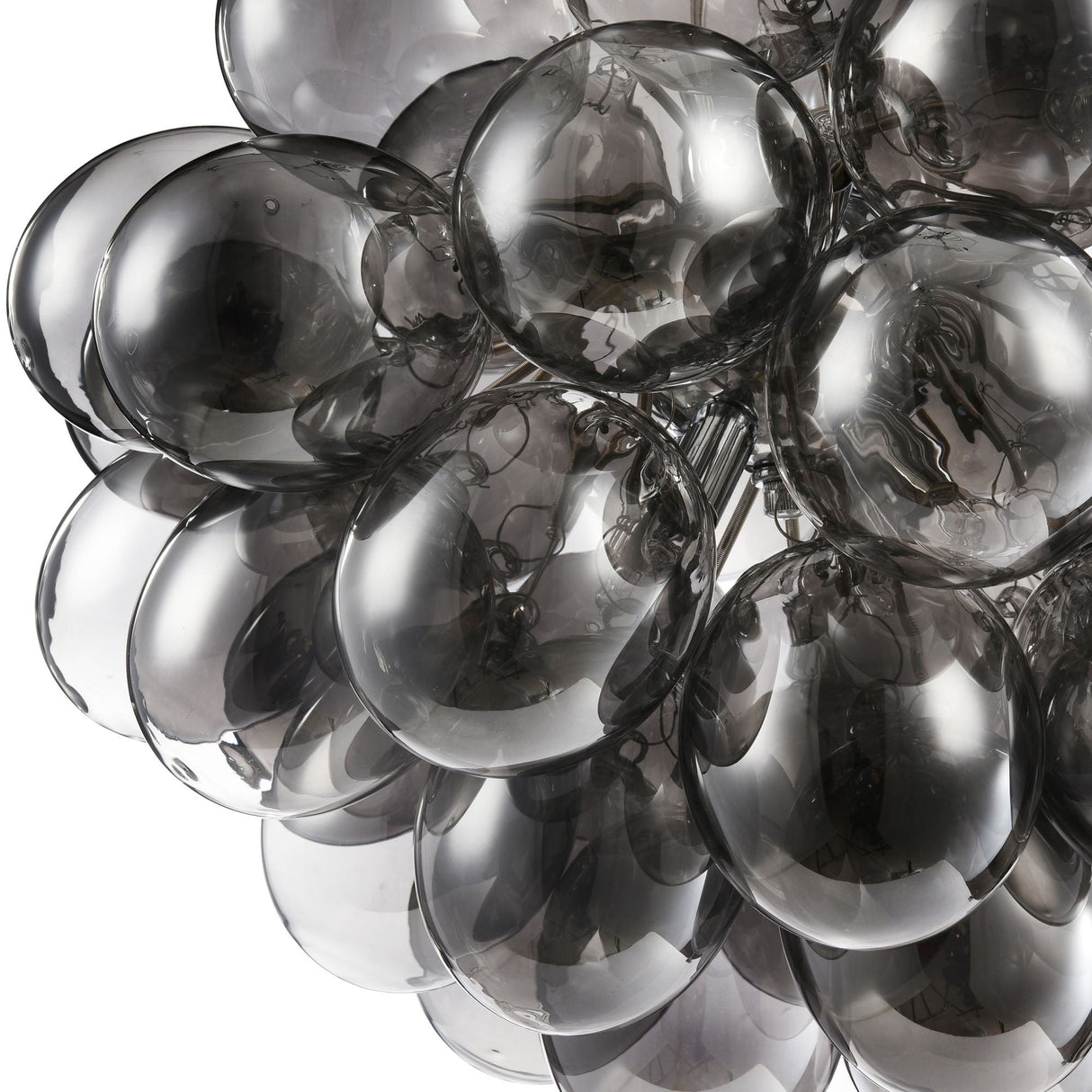 The Balbo 8 Light Chandelier - Nickel with Smoky Glass features overlapping translucent smoky glass domes, creating an elegant look. These orbs softly reflect light, adding sophistication to any contemporary space.