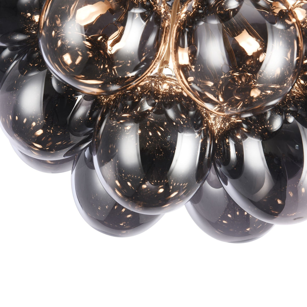 Close-up view of smoky glass orbs on a metallic gold frame, similar to the Balbo 8 Light Semi-Flush - Nickel with Smoky Glass fixture. The reflective orbs add a modern luxury design, mirroring their surroundings for visual complexity.