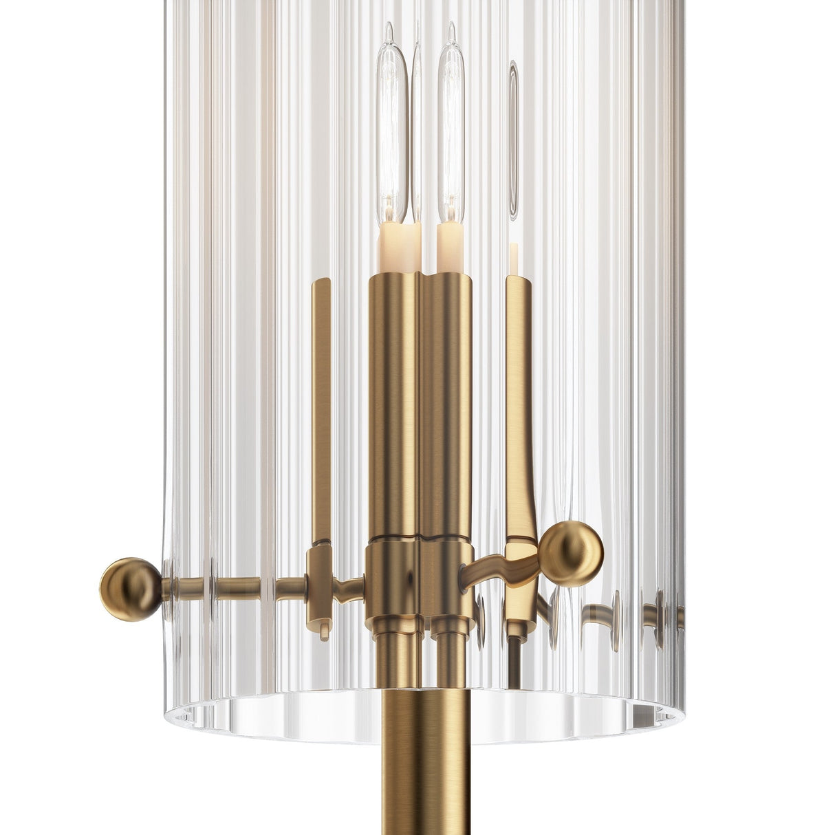 A close-up of the Arco 2 Light Wall Light (MOD223WL-02BS1) showcases its cylindrical ribbed glass and sleek polished brass accents, revealing three candle-shaped light bulbs that enhance its elegant design.